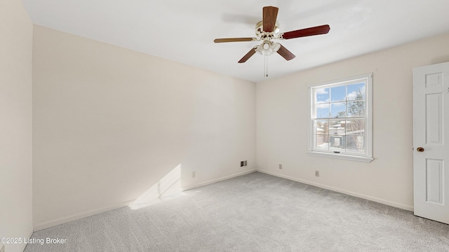 carpeted empty room with ceiling fan