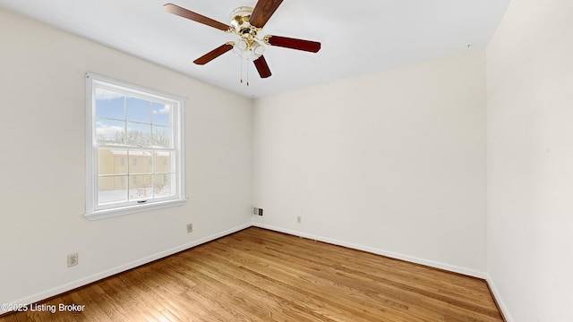 empty room with ceiling fan and light wood-type flooring