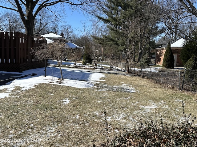 view of yard covered in snow