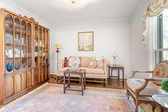 living area with ornamental molding and wood-type flooring