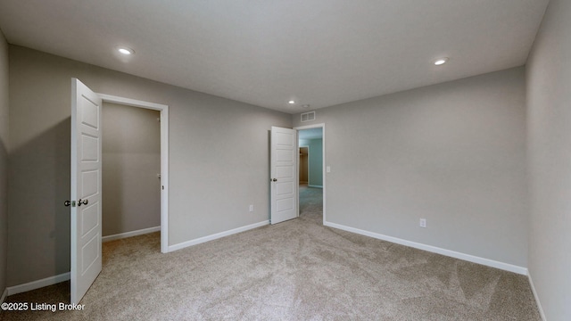 unfurnished bedroom featuring light colored carpet