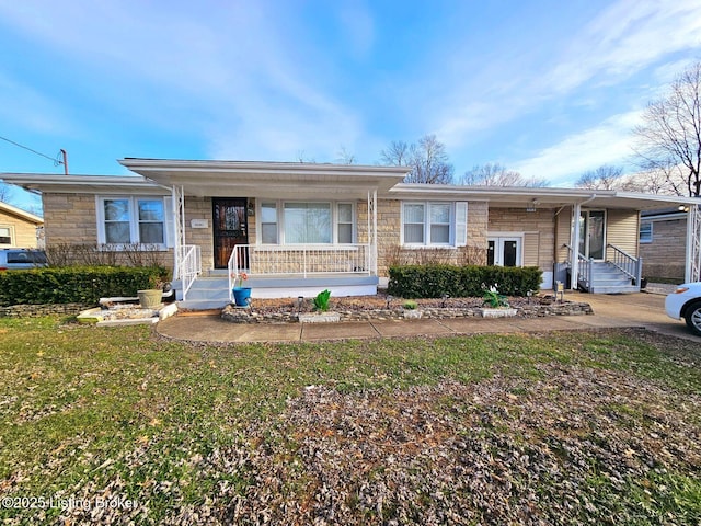 single story home featuring a front yard