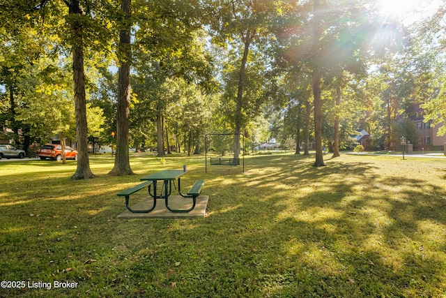 view of property's community with a yard