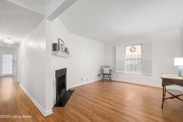 interior space with hardwood / wood-style floors and ornamental molding