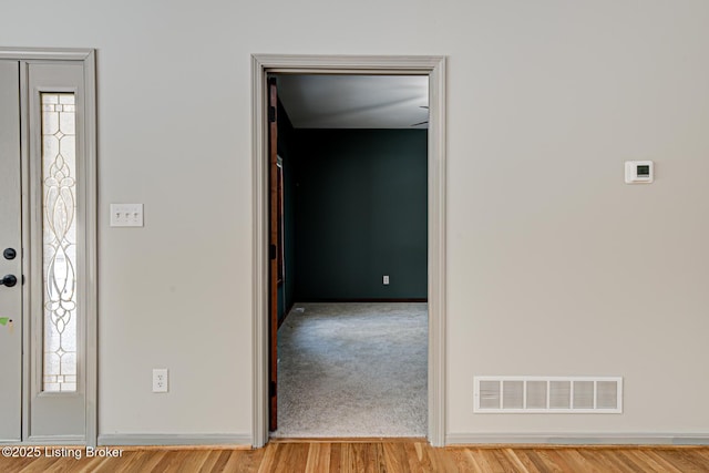 foyer entrance with light hardwood / wood-style floors