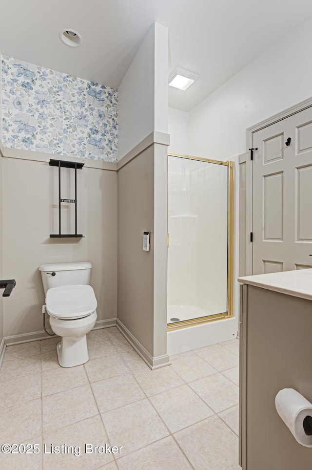 bathroom featuring toilet, tile patterned flooring, and walk in shower