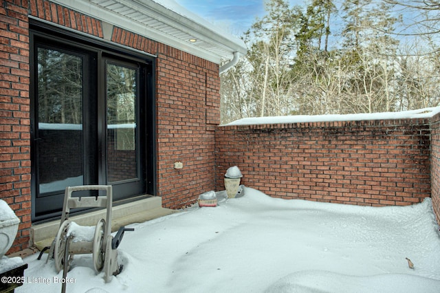 view of snow covered patio