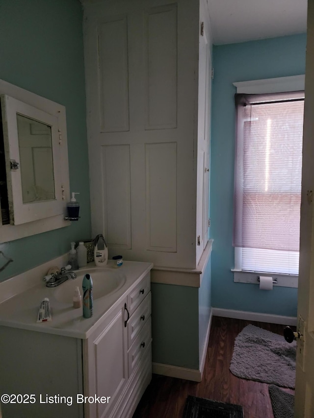 bathroom with vanity and wood-type flooring