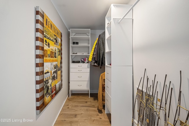 spacious closet featuring light hardwood / wood-style flooring