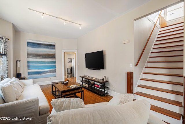 living room featuring track lighting and hardwood / wood-style floors