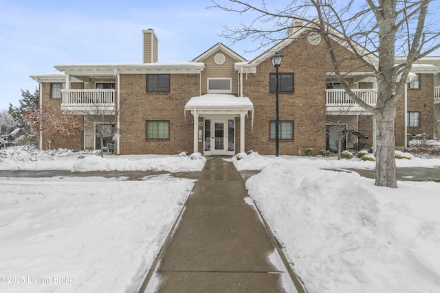 view of front of home with a balcony