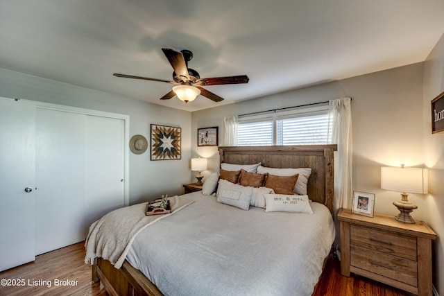 bedroom featuring a closet, ceiling fan, and dark wood-type flooring