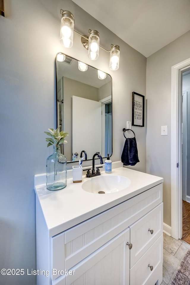 bathroom featuring tile patterned floors and vanity