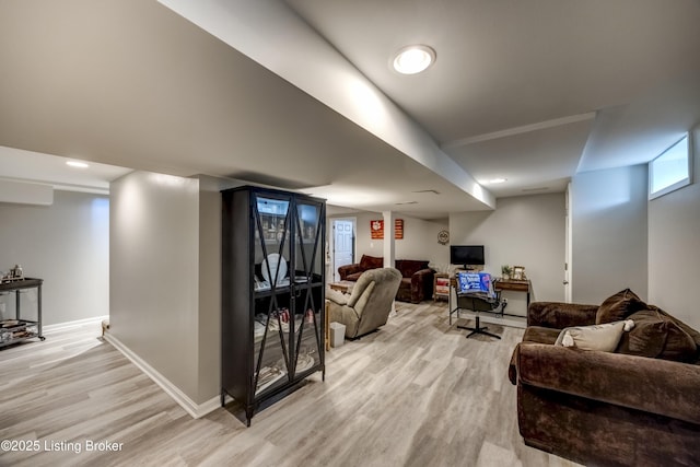 living room with light hardwood / wood-style flooring