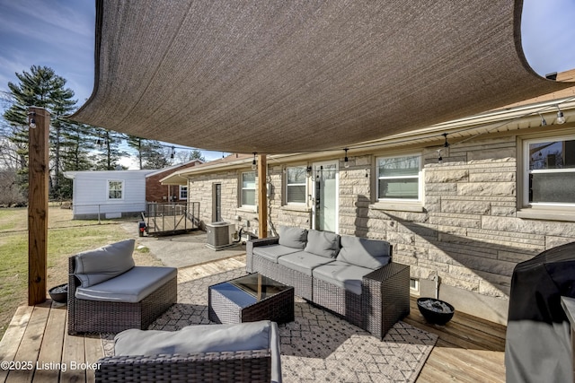 wooden deck featuring a grill, central air condition unit, an outdoor structure, and outdoor lounge area