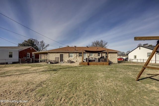 rear view of house featuring a lawn and a patio area