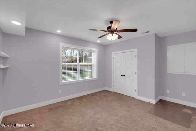 unfurnished bedroom with carpet flooring, a closet, and ceiling fan