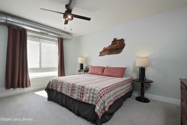 bedroom with light colored carpet and ceiling fan