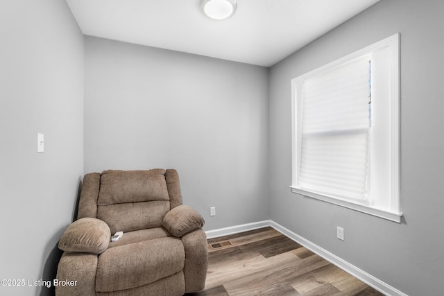 living area with wood-type flooring