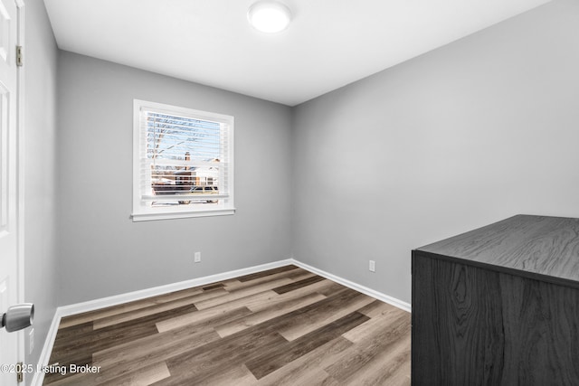 empty room featuring hardwood / wood-style flooring