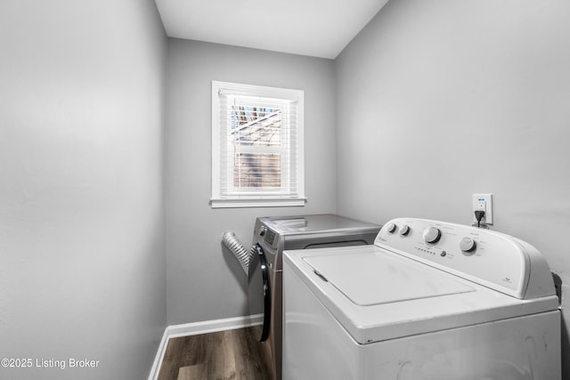 laundry area featuring dark wood-type flooring and washer and clothes dryer