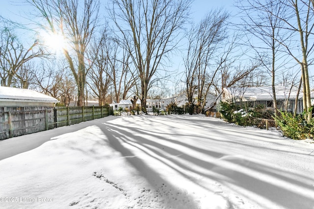 view of yard layered in snow