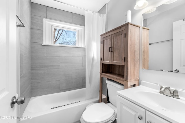 full bathroom featuring toilet, vanity, and shower / bath combination with curtain