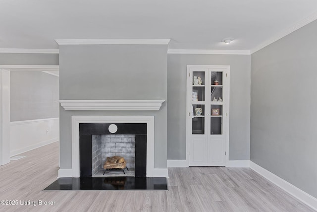 unfurnished living room featuring crown molding and light wood-type flooring