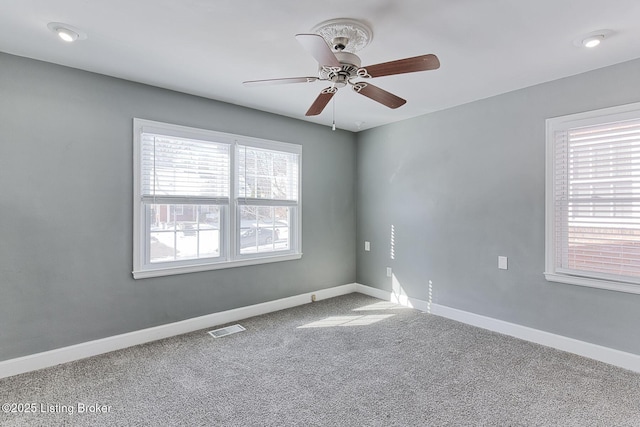 empty room with carpet floors and ceiling fan