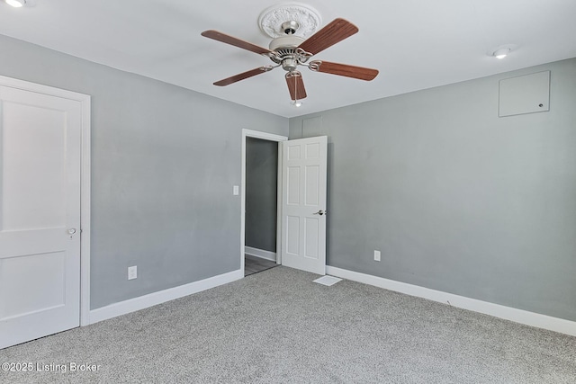 unfurnished room featuring carpet and ceiling fan