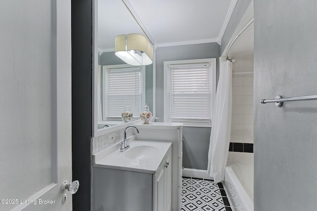 bathroom with tile patterned flooring, crown molding, shower / bathtub combination with curtain, and vanity