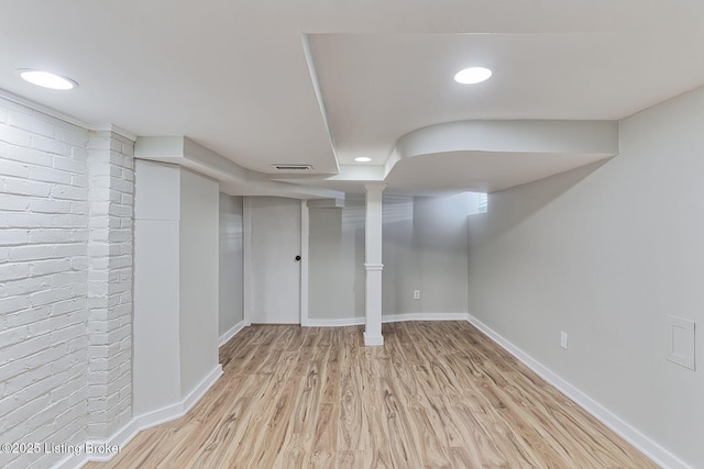 basement featuring light hardwood / wood-style floors