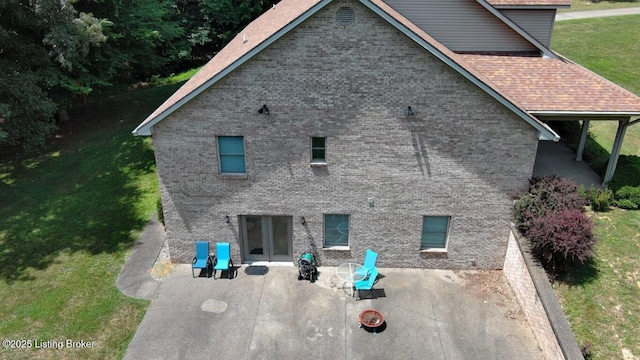 exterior space with a lawn and a patio area