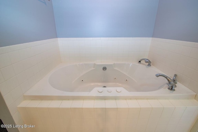 bathroom featuring tiled bath