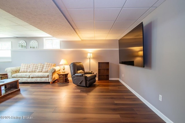 sitting room with a healthy amount of sunlight and dark wood-type flooring