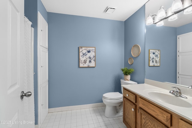 bathroom featuring toilet and vanity