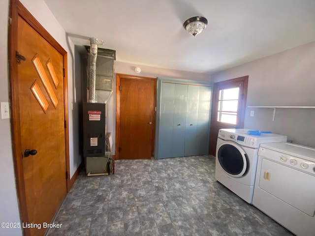 laundry area with separate washer and dryer