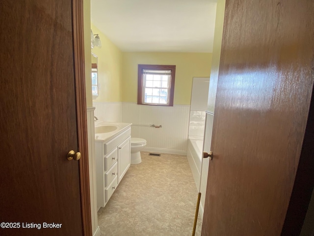 bathroom featuring vanity and toilet