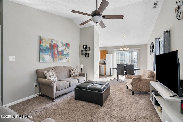 living room with lofted ceiling, ceiling fan with notable chandelier, a textured ceiling, and light colored carpet