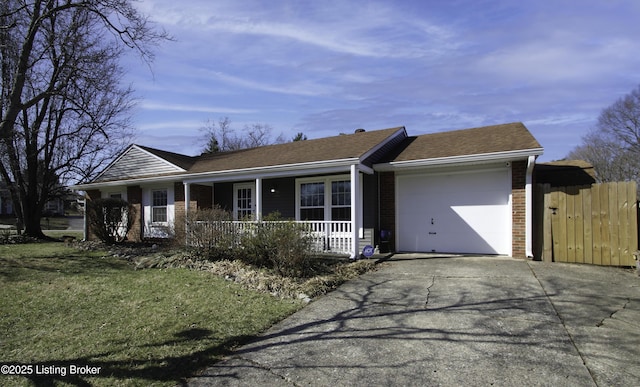 single story home featuring brick siding, fence, covered porch, driveway, and an attached garage