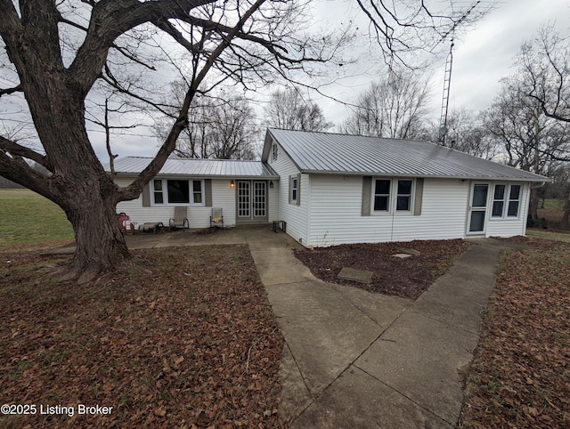 single story home featuring a patio