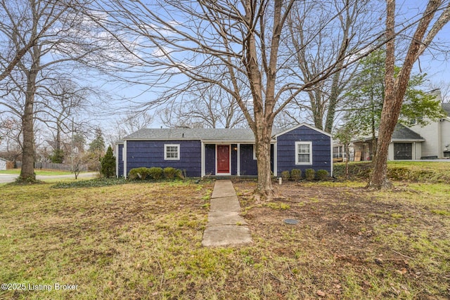 ranch-style house featuring a front lawn