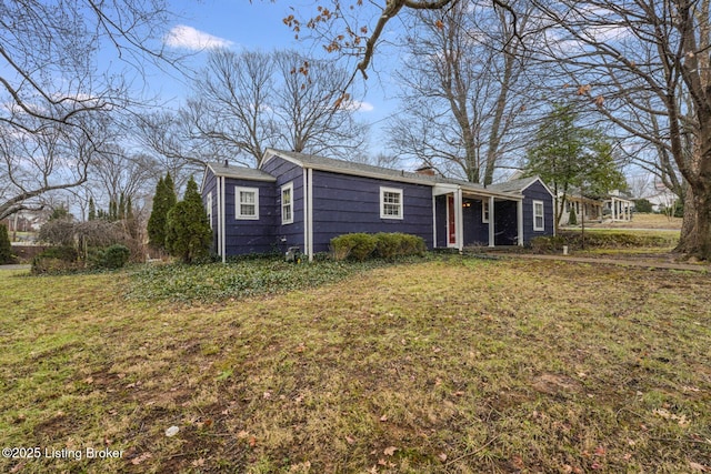 ranch-style home with a front yard