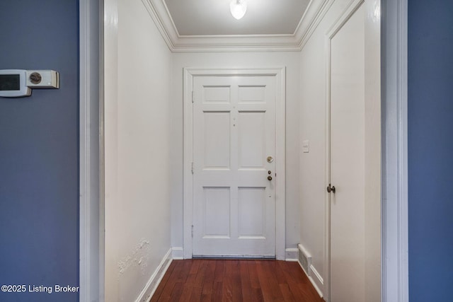 doorway with dark hardwood / wood-style flooring and ornamental molding