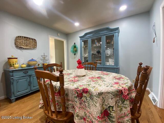 dining room with light hardwood / wood-style floors