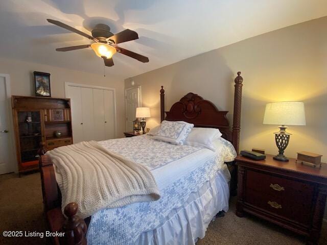 bedroom with dark colored carpet, ceiling fan, and a closet