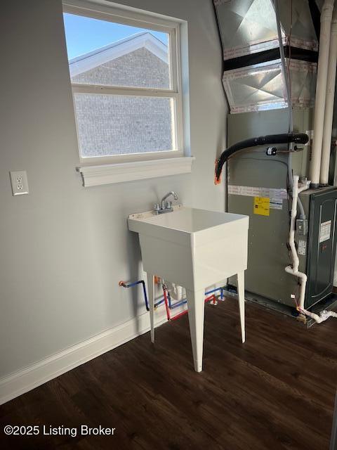 utility room with heating unit