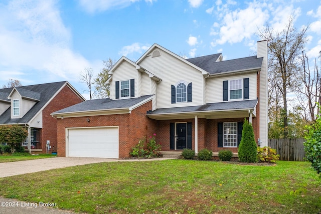 view of front property with a front yard and a garage