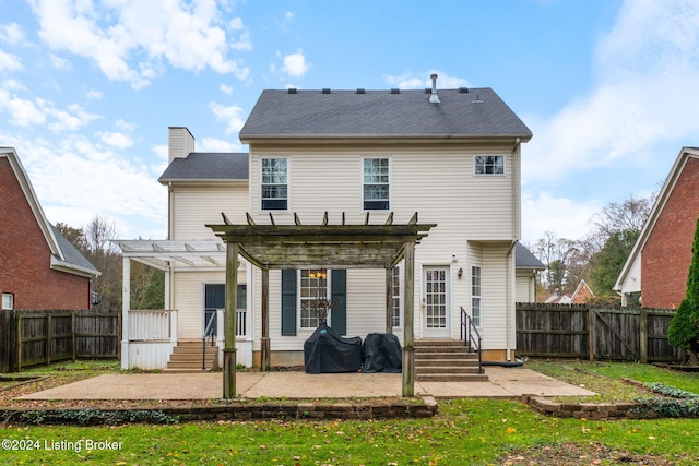 back of property with a patio area and a pergola