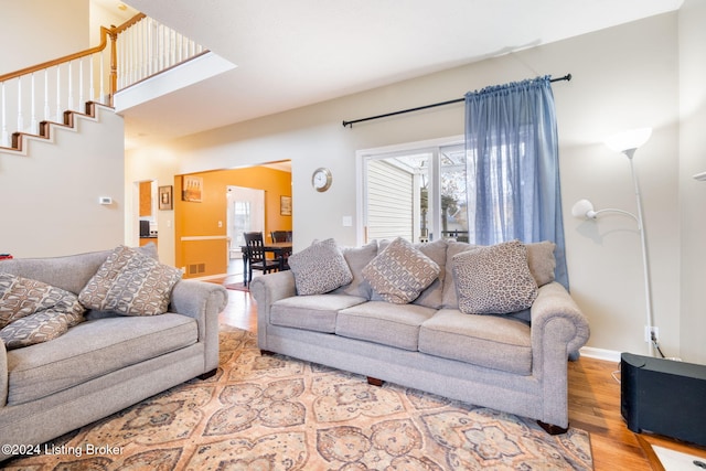 living room with light hardwood / wood-style flooring